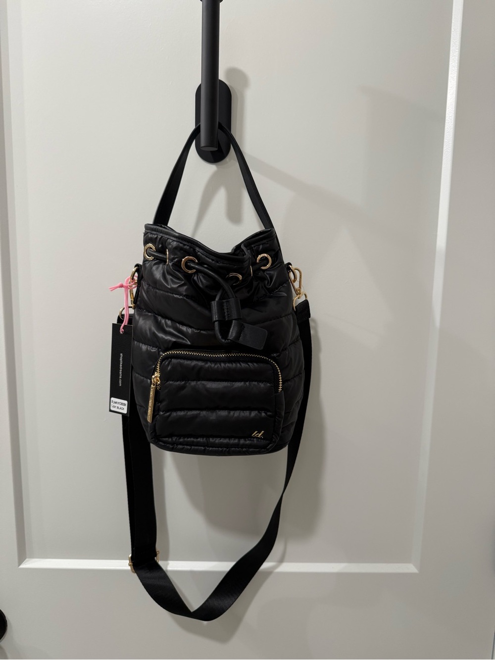Black Quilted Drawstring Shoulder Bag with Front Zip Pocket
